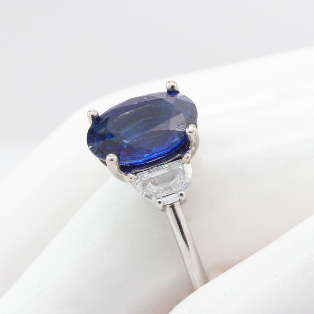 Oval Blue Sapphire with diamond side-stones Engagement Ring