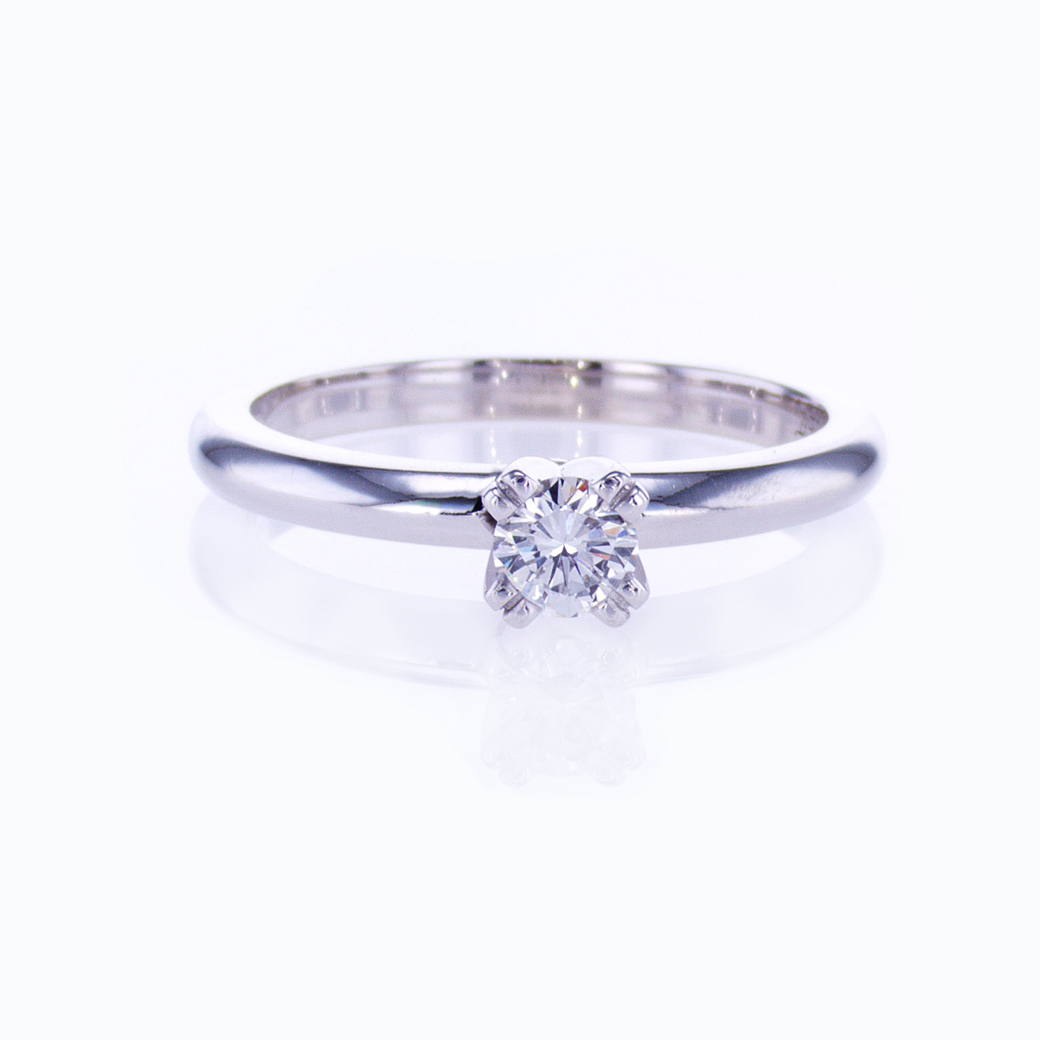 Classic Four-prong Solitaire Engagement Ring and Diamond