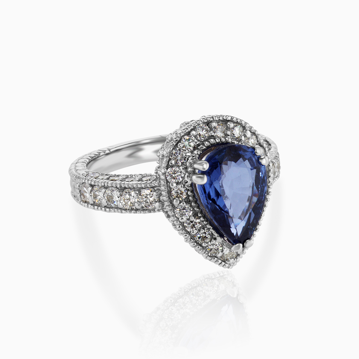 Pear-shaped Natural Blue Sapphire and Diamond Halo Engagement Ring