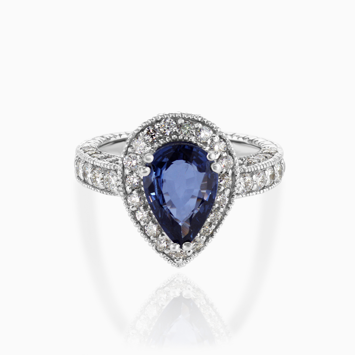 Pear-shaped Natural Blue Sapphire and Diamond Halo Engagement Ring